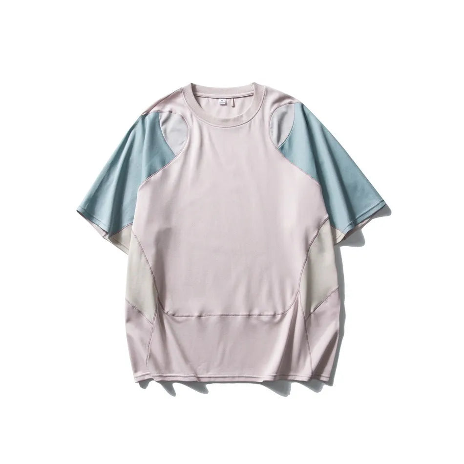 Men's loose blue patchwork t-shirt with raglan short sleeves on a white background.