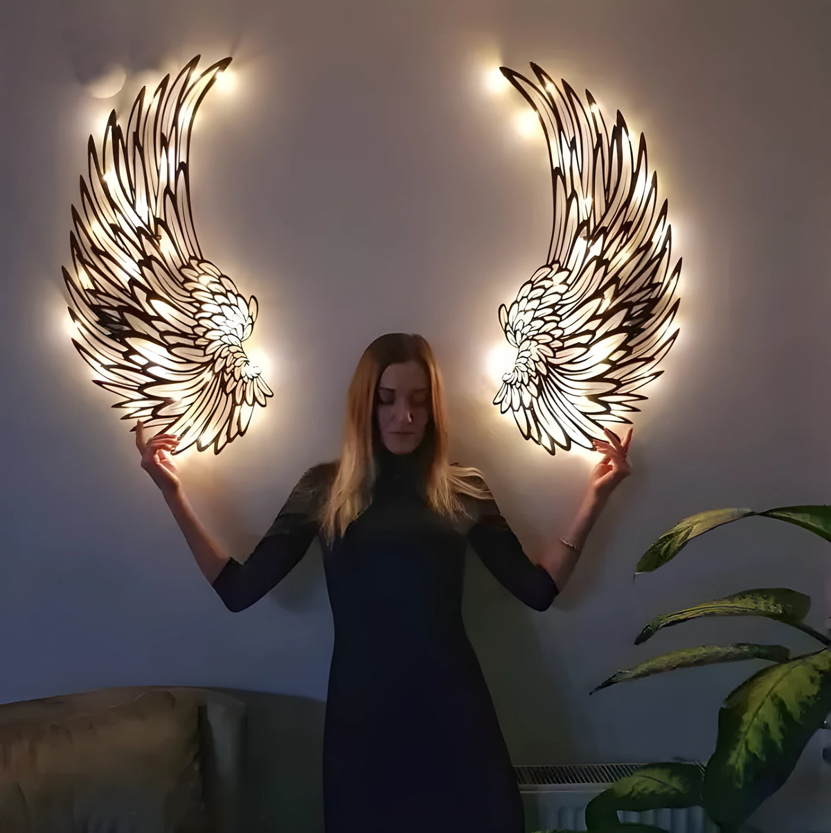 Carved metal angel wings wall decor in iron with double-sided black finish, available with or without light