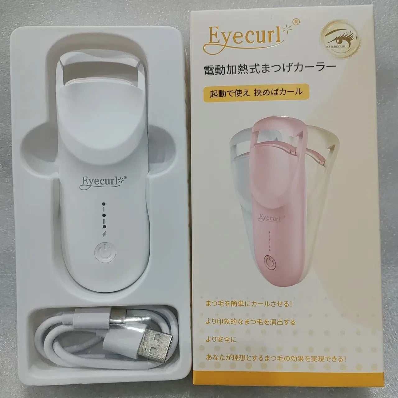 Electric heating eyelash curler in cream white colour with USB charging cable
