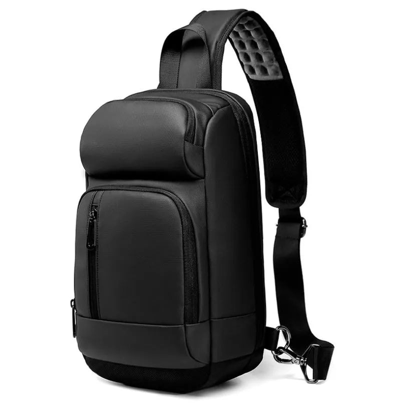 Black square-shaped outdoor shoulder bag with a single adjustable strap, shown with open zipper revealing internal laptop and phone pockets.