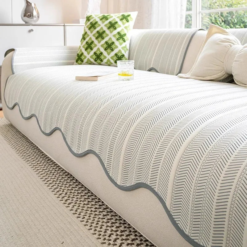 Ice silk fixed non-slip sofa cover in a special pattern, shown in jelly green colour on a couch.