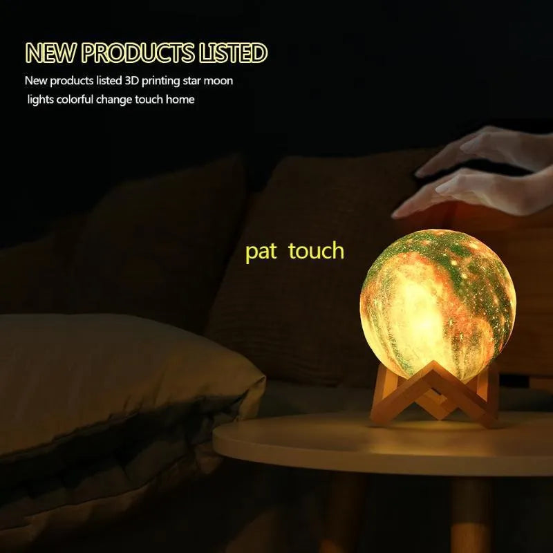 3D-printed white lunar sphere LED night light on a dark surface, showing detailed crater texture.