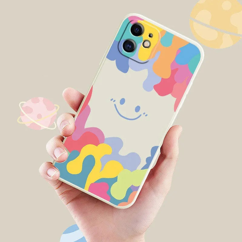 White TPU iPhone case with rainbow smiley face design and attached lanyard
