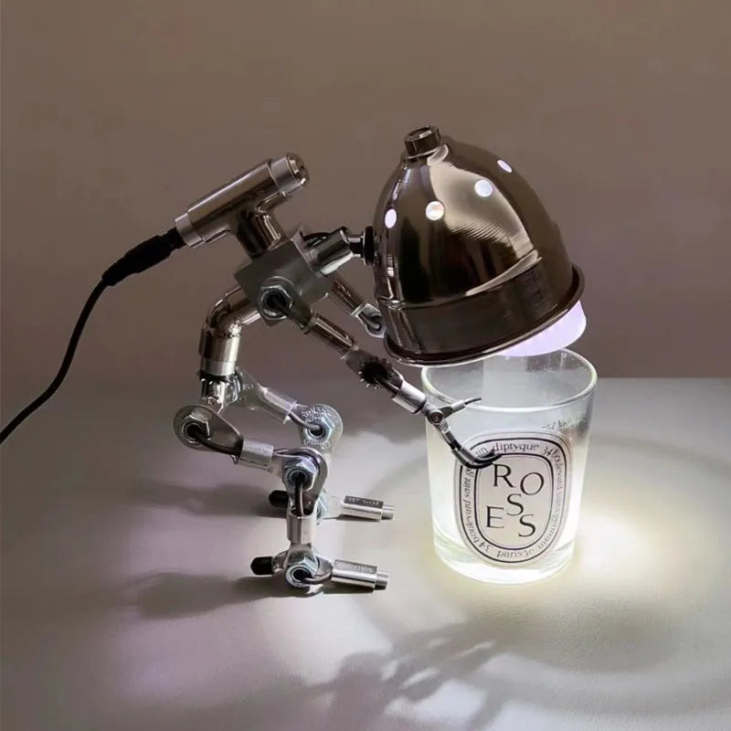 Creative silver or copper robot-shaped decorative desk lamp in 22cm or 29cm size.