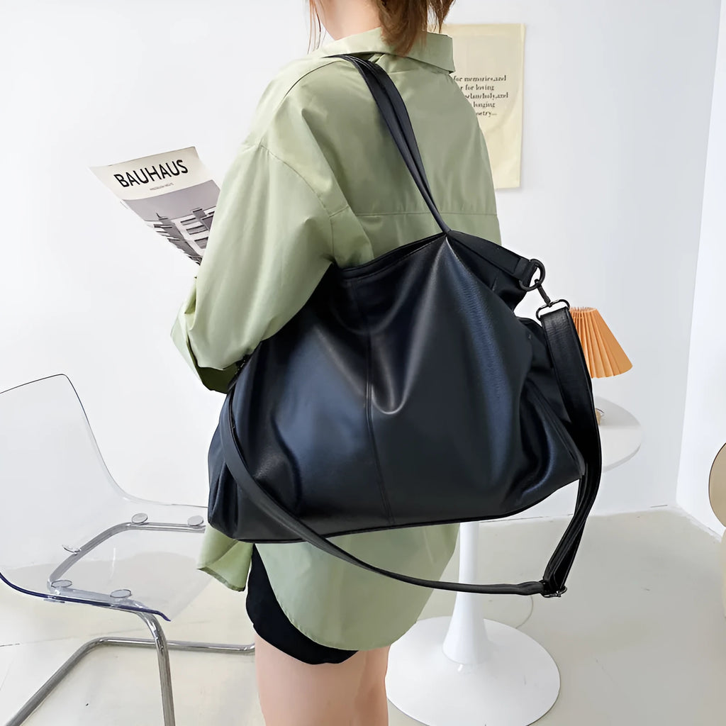 Large soft white PU messenger bag with a long cross-body shoulder strap and zip closure