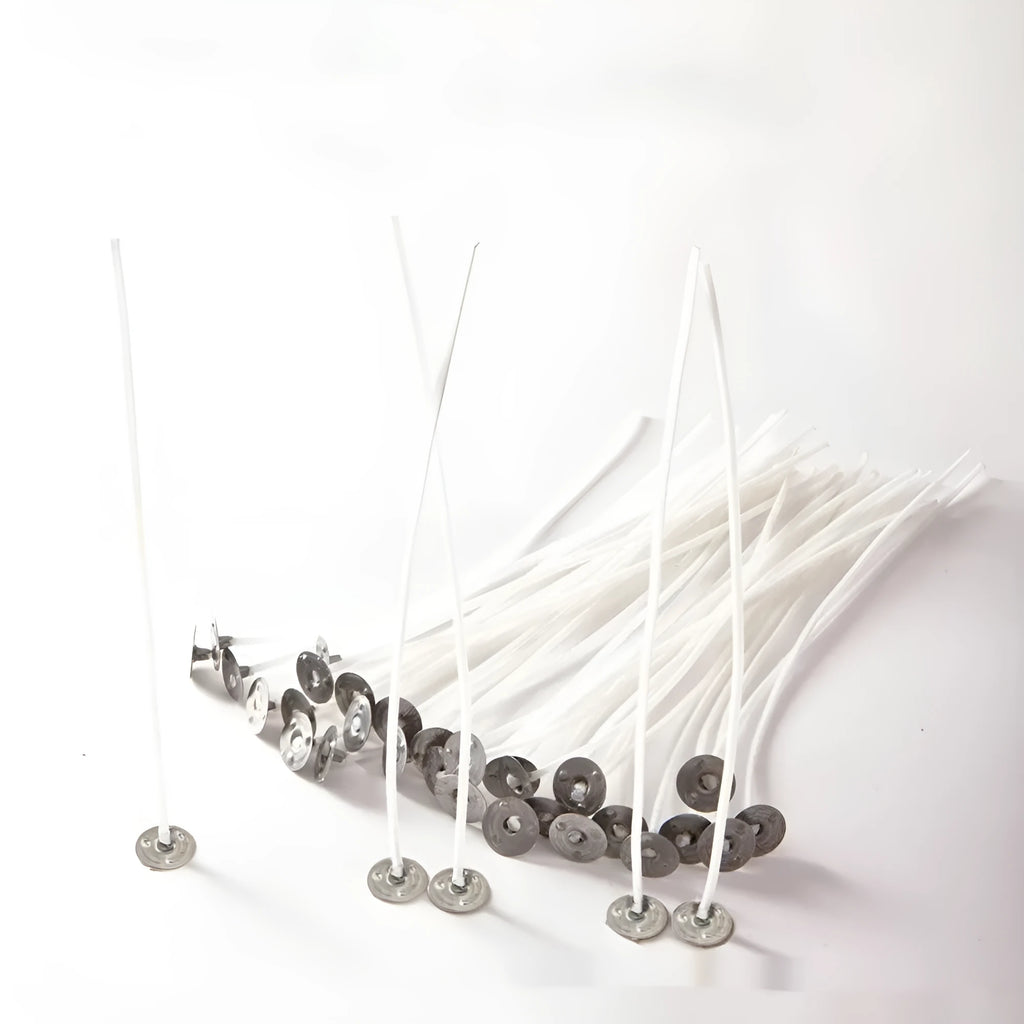 White cotton candle wicks for DIY candle making in three length options on craft background