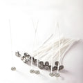 White cotton candle wicks for DIY candle making in three length options on craft background