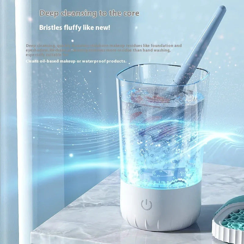 White rechargeable electric cleaning brush for makeup brushes with USB cable.