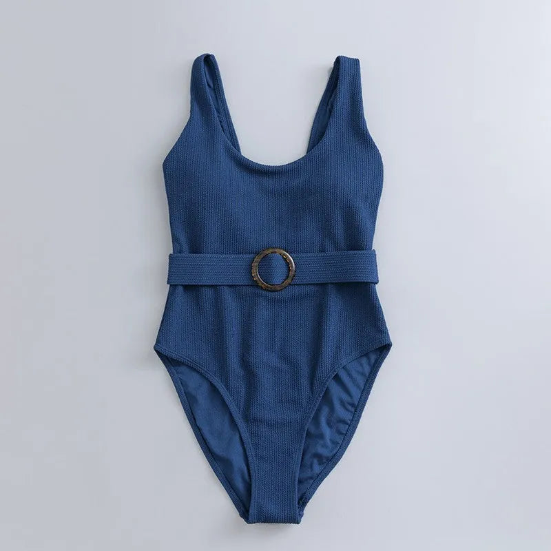 Navy blue women's one-piece triangle swimsuit with chest pads on a mannequin, showing the sleeveless slimming design.