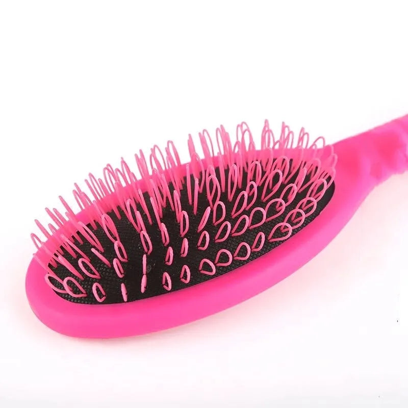Black ABS plastic airbag comb for hair extensions measuring 22 by 6 centimetres