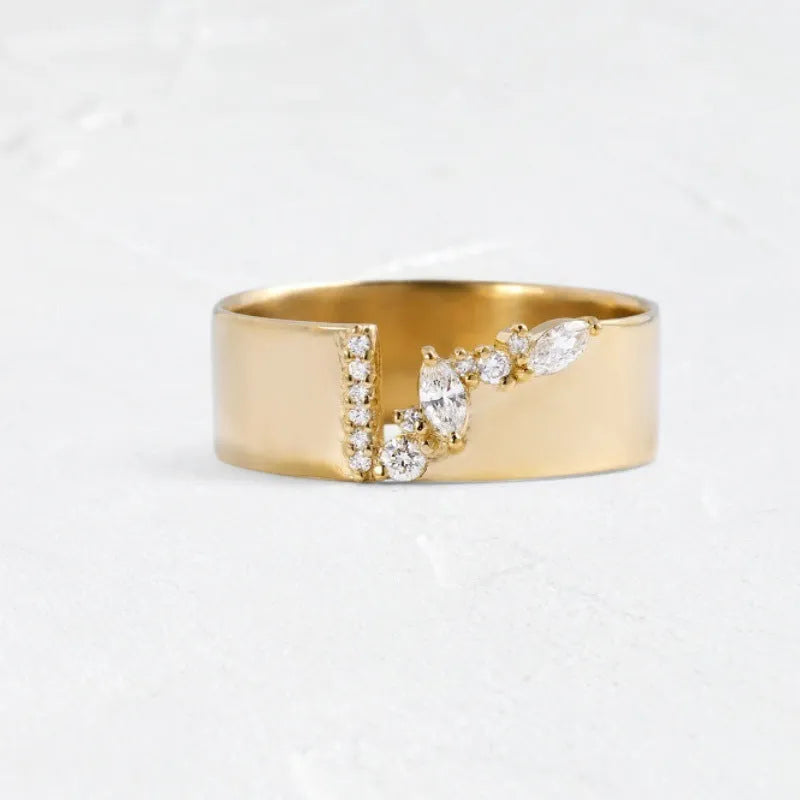 Gold coloured women's ring with a shining zircon stone on a copper band.
