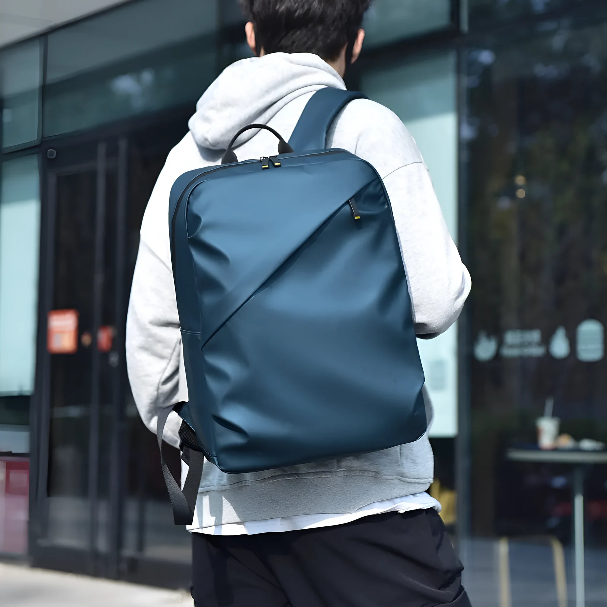 Large black waterproof PU leather backpack with sewing thread detailing