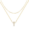 Sterling silver double layer cross pendant with twin diamonds on a clavicle chain.