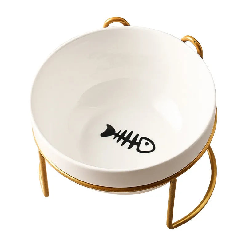 White ceramic cat bowl with paw print design in a black iron cat-ear frame.