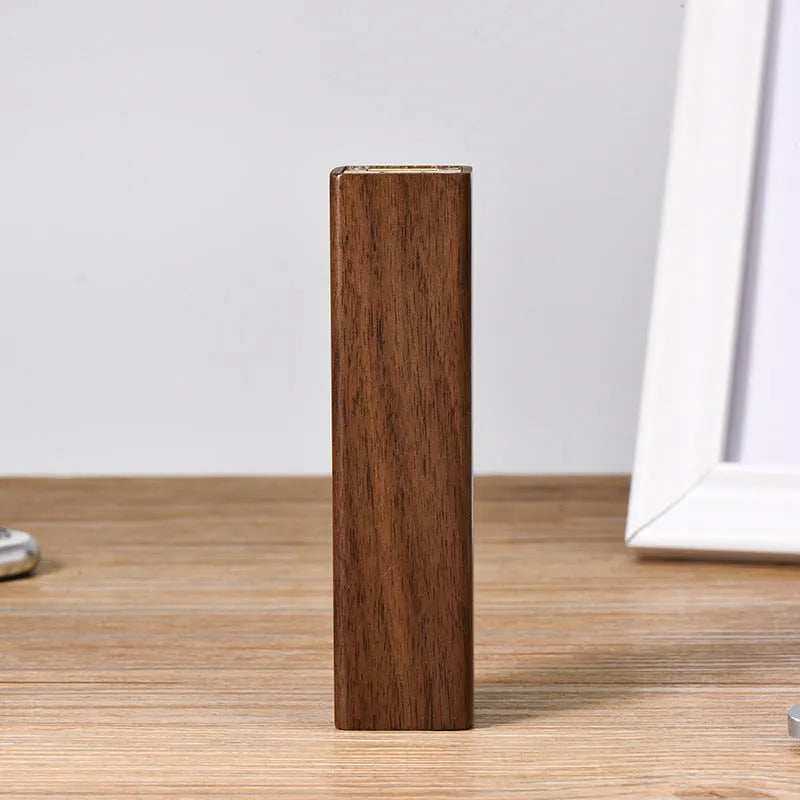 Brown walnut wood portable power bank with 2000mAh capacity and gift box packaging.