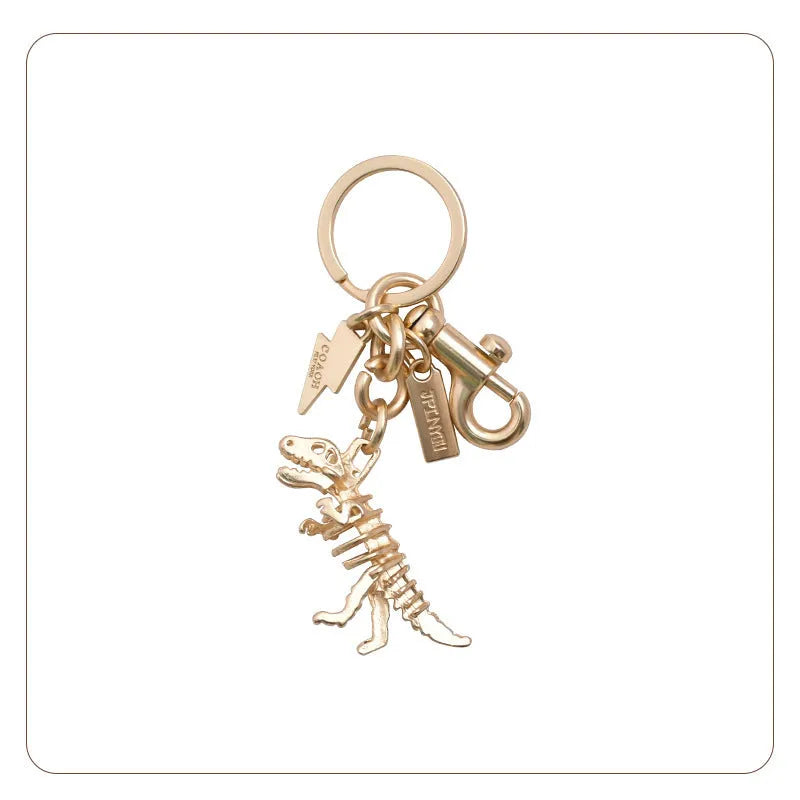 Golden Bone Dragon zinc alloy dinosaur keychain on a white background