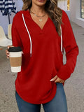 Women's red V-neck hooded sweatshirt with long sleeves in loose fit