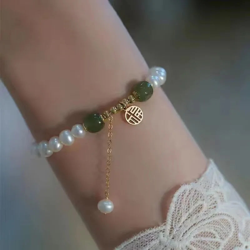 Chinese style glass bead bracelet with bamboo leaf design and manual craftsmanship details.