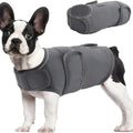 Grey dog anxiety vest with adjustable straps, shock protection features, worn by a small dog, sizes XS-XXXL available