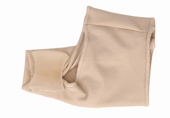 Corrective toe socks with a silicone gel bunion pad and toe separator on a grey background.