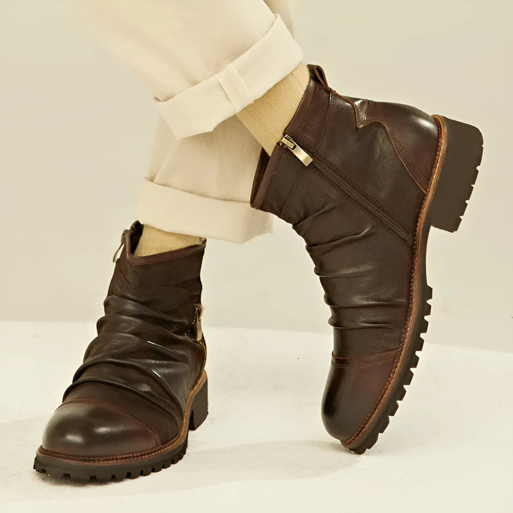 Black mid-calf cowboy boots with side zipper, round toe, and a medium horseshoe heel.