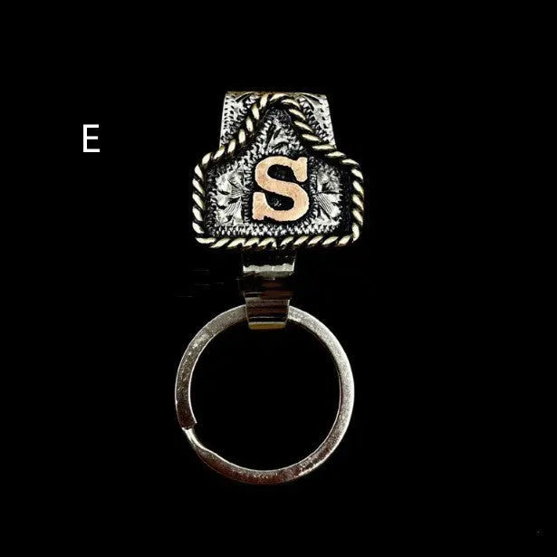 Handmade metal cow tag belt keychain in rustic design with multiple colour options
