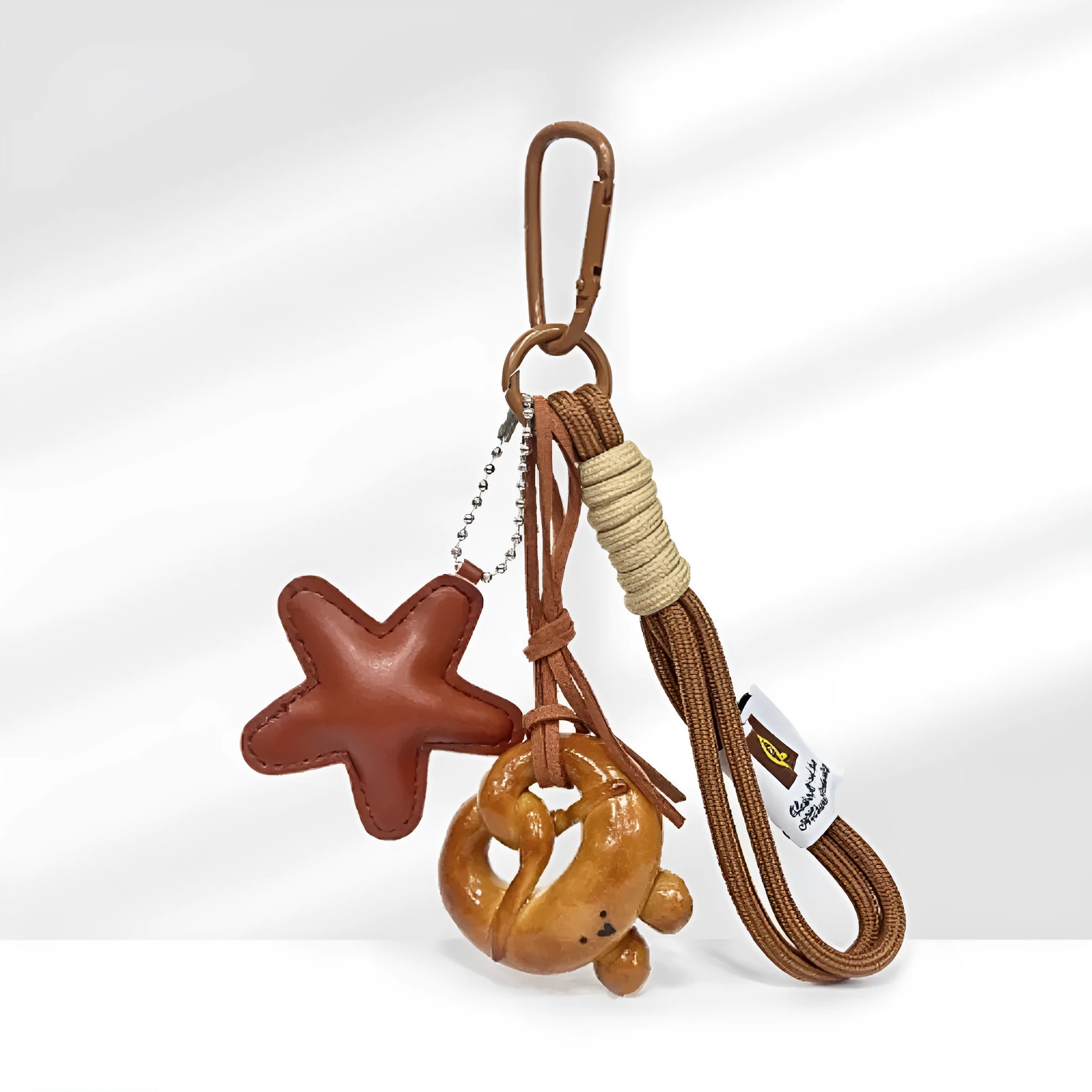 Handmade soda bread style resin handbag pendant on a brown 30 cm strap.