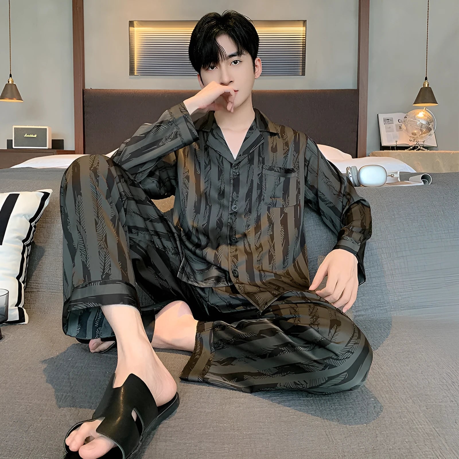 Men's black striped ice silk pajama set with V-neck top and elastic trousers