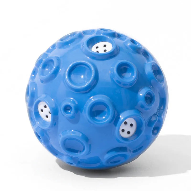 Durable elastic rubber dog toy ball in assorted colours with a textured surface for teeth cleaning.