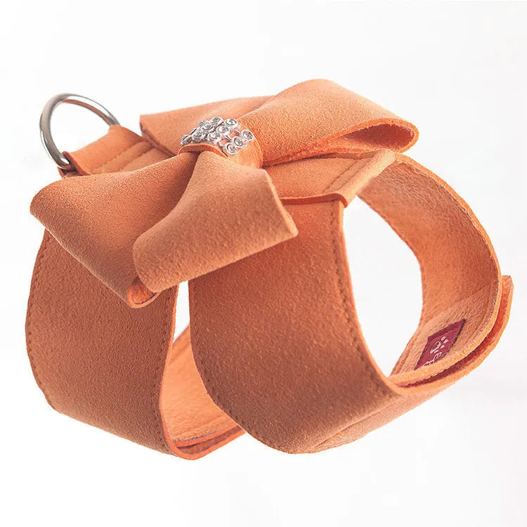 Dog wearing pink microfiber chest strap with decorative bowknot design