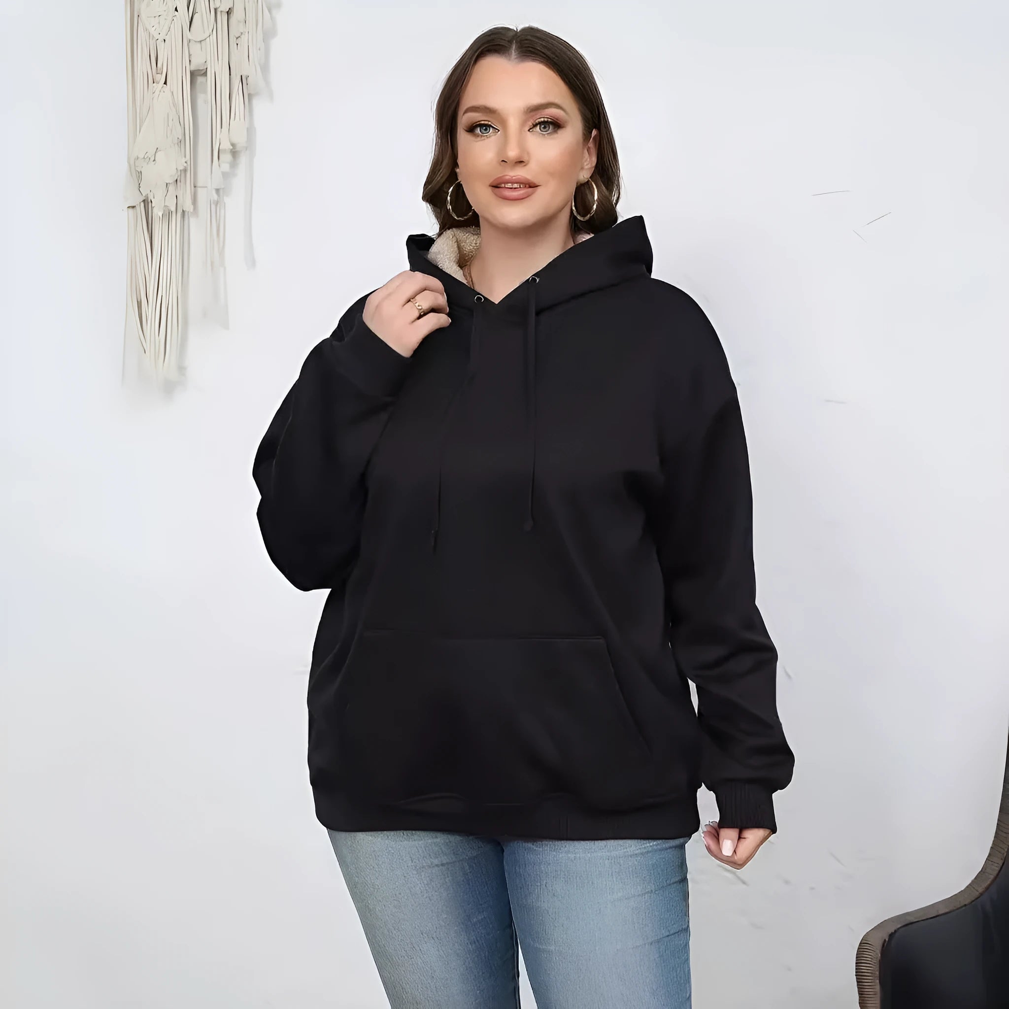 Women's black hooded sweater with 3D pattern design and front pockets