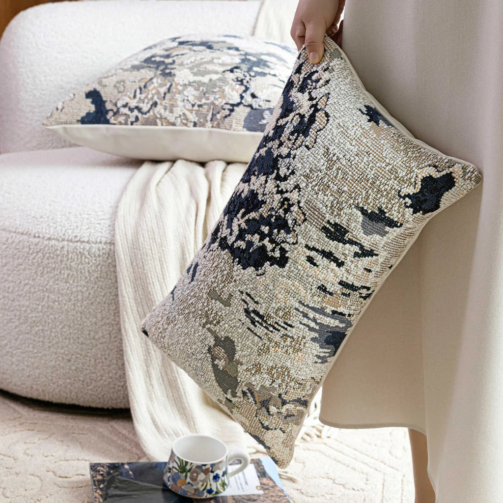 Antique blue decorative pillow with abstract flower pattern, shown in square and waist pillow sizes.