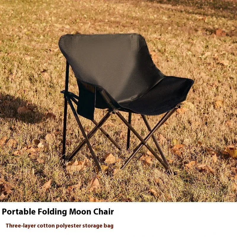 Steel-framed folding chair with Oxford cloth seat in outdoor setting