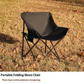 Steel-framed folding chair with Oxford cloth seat in outdoor setting