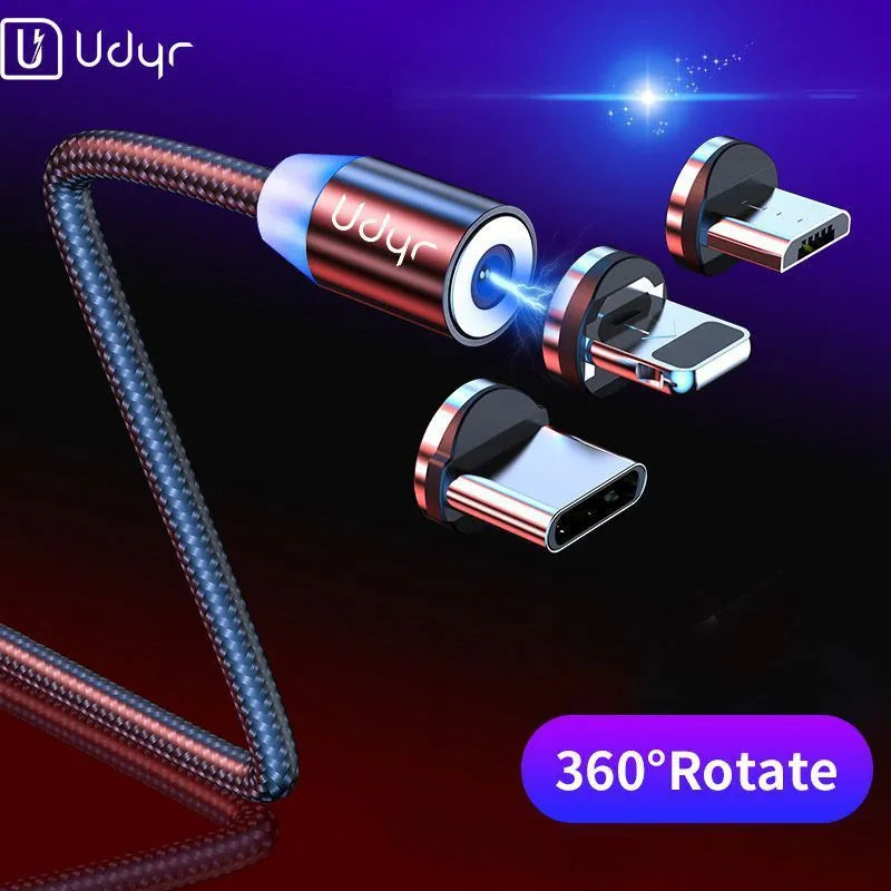 Black magnetic USB cable with detachable Android, Apple iPhone, and Type-C magnetic heads on a table.