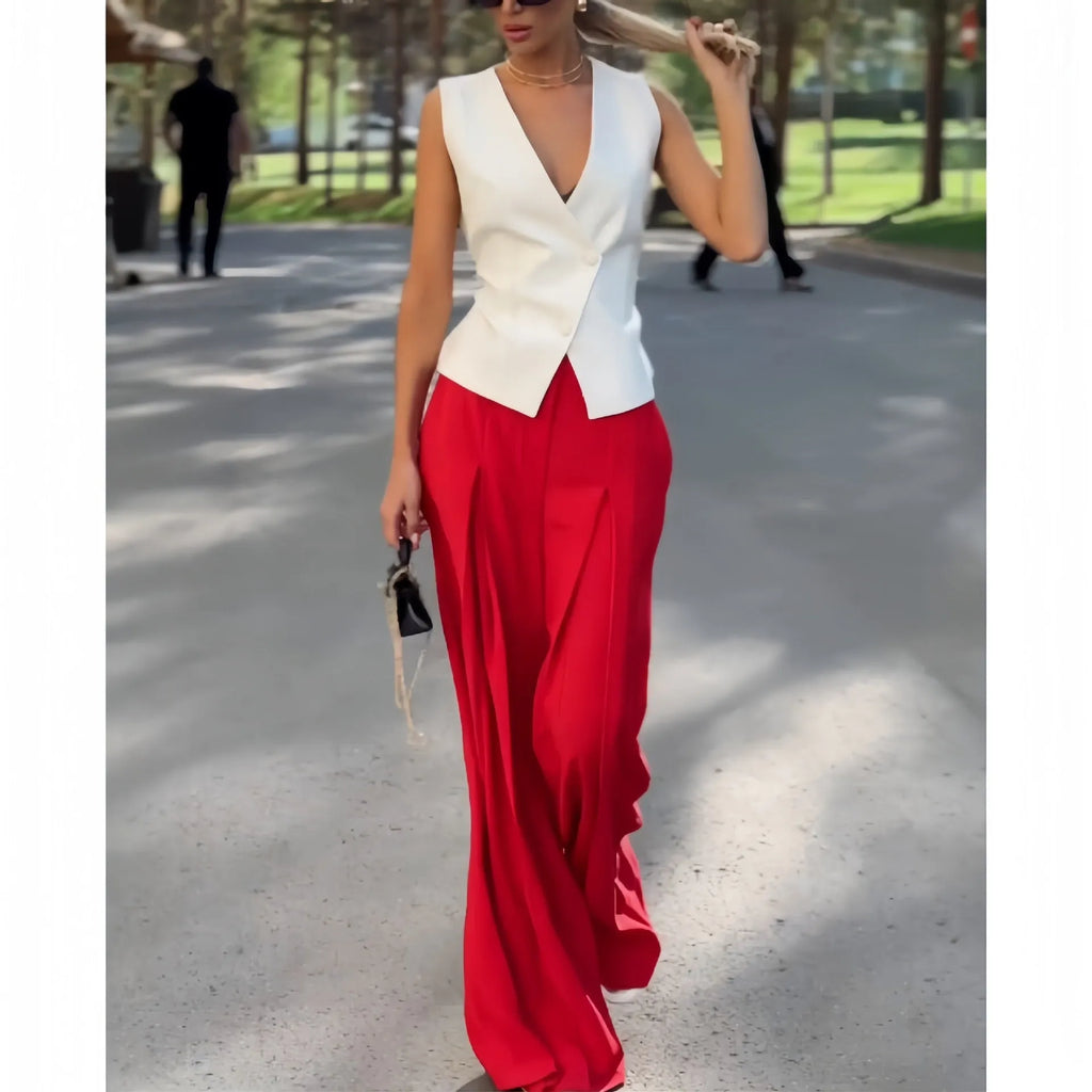 Beige women's two-piece set with sleeveless V-neck top and wide-leg trousers on a hanger.