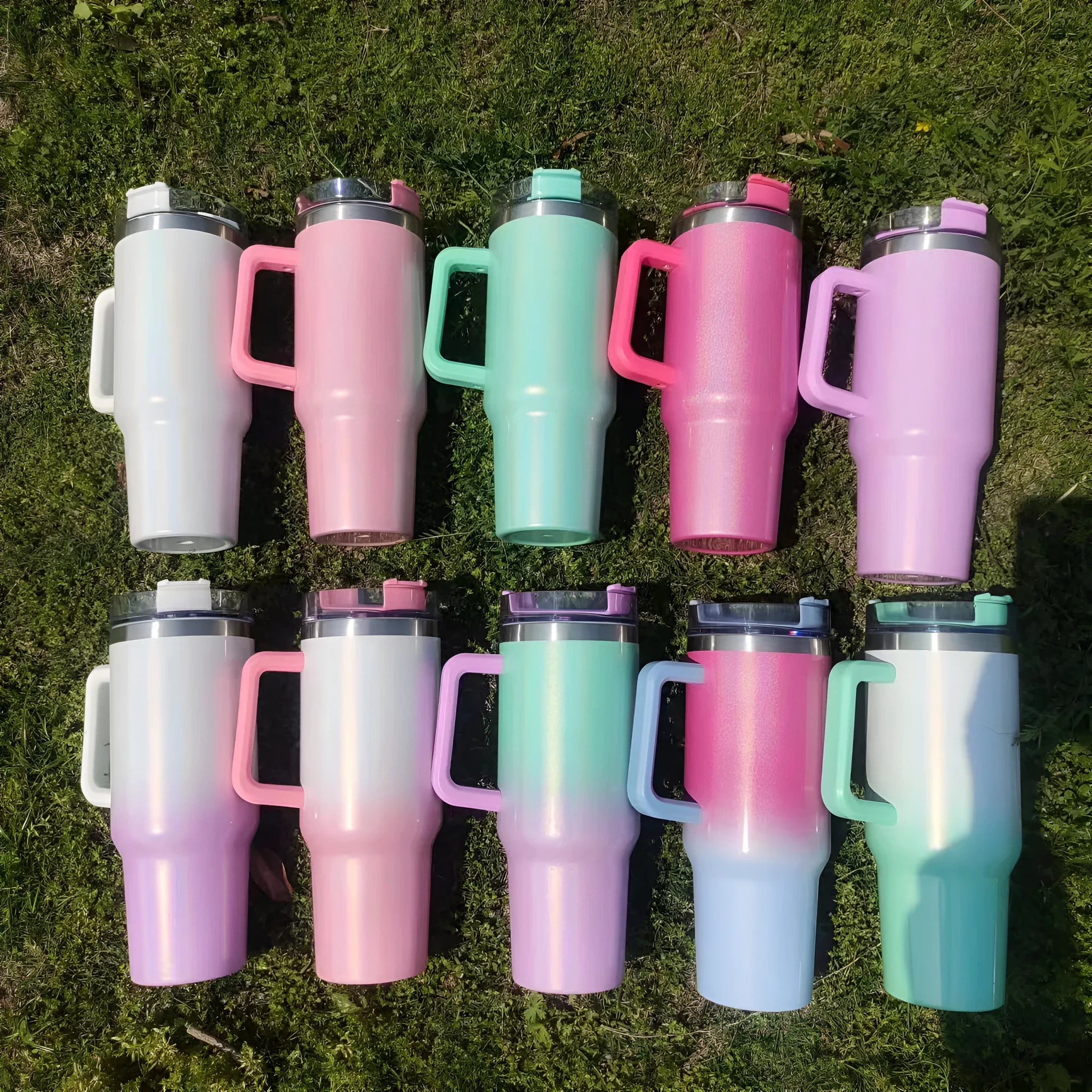 Large stainless steel vacuum insulation cup showing gradient colour options on a white background.