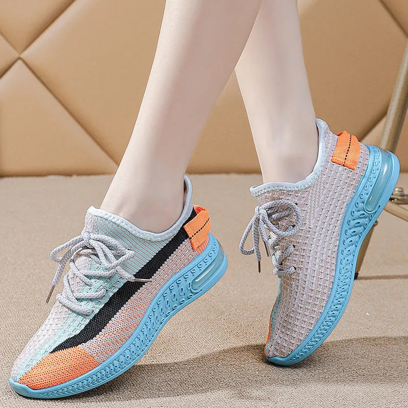 Women's casual running shoes in purple, black and orange colours with round toe and lace-up design