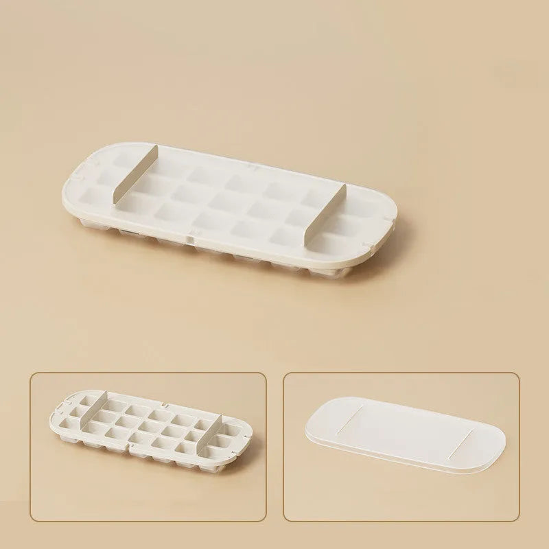 High capacity blue ice cube tray with ice grid and attached storage for the included shovel.