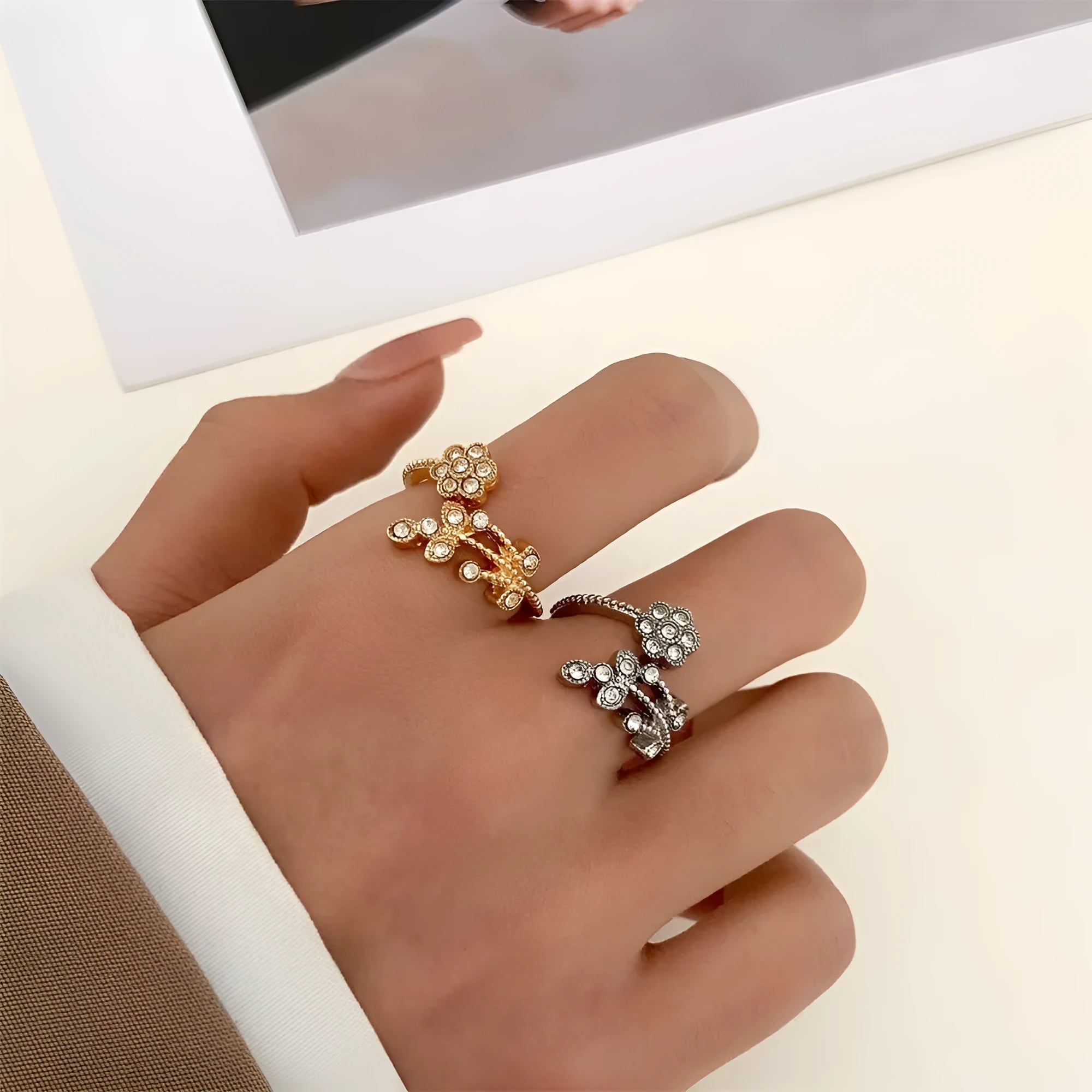 Open mouth floral ring with diamond-treated surface showing flower and leaf pattern in copper