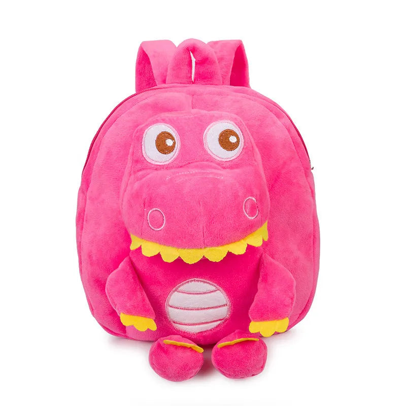 Blue dinosaur plush backpack with embroidered character, soft handle, and backpack straps showing 20-litre capacity