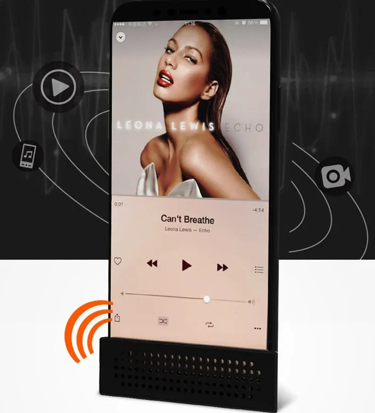 Mini black mobile phone amplifier bracket holding iPhone on desktop surface