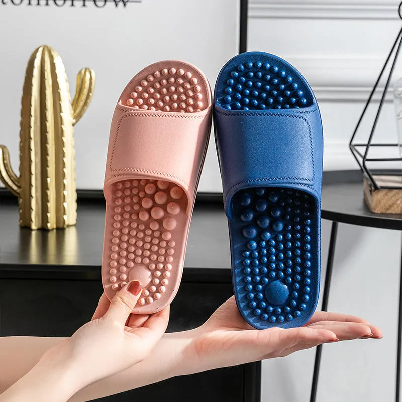 Pair of non-slip PVC massage slippers with breathable upper and wear-resistant injection-moulded sole, available in seven colours.