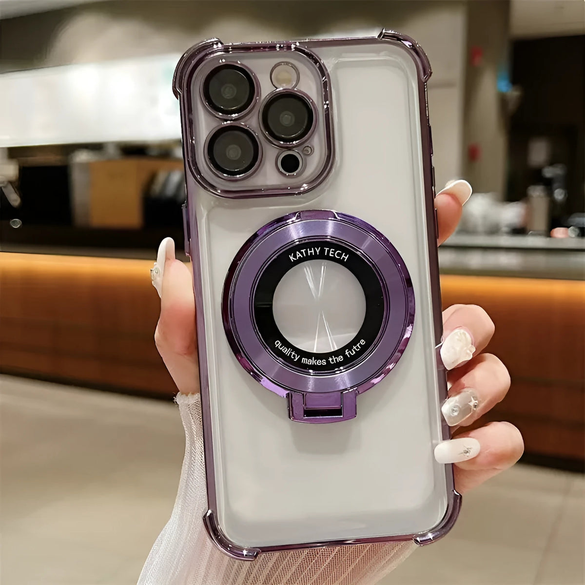 Transparent acrylic iPhone case with four-corner fall protection and built-in lens protector in black.