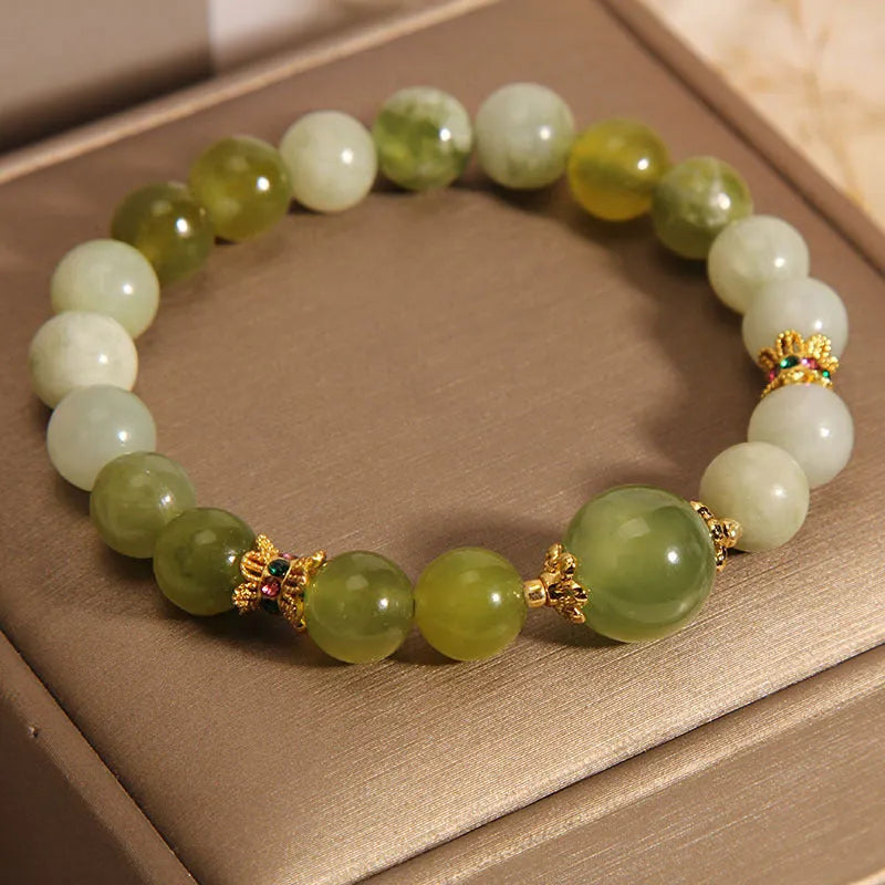 Women's Xiuyan jade bracelet in jade green with an original sweet mori style design.
