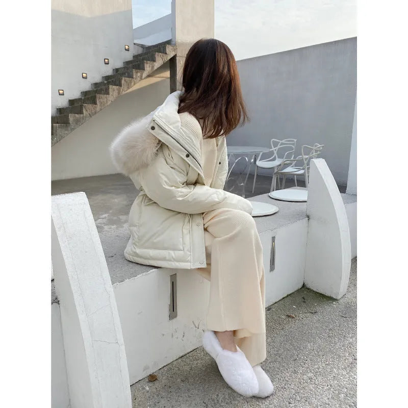Women's high-waisted wide-leg knitted trousers in cream white, casual autumn winter style.