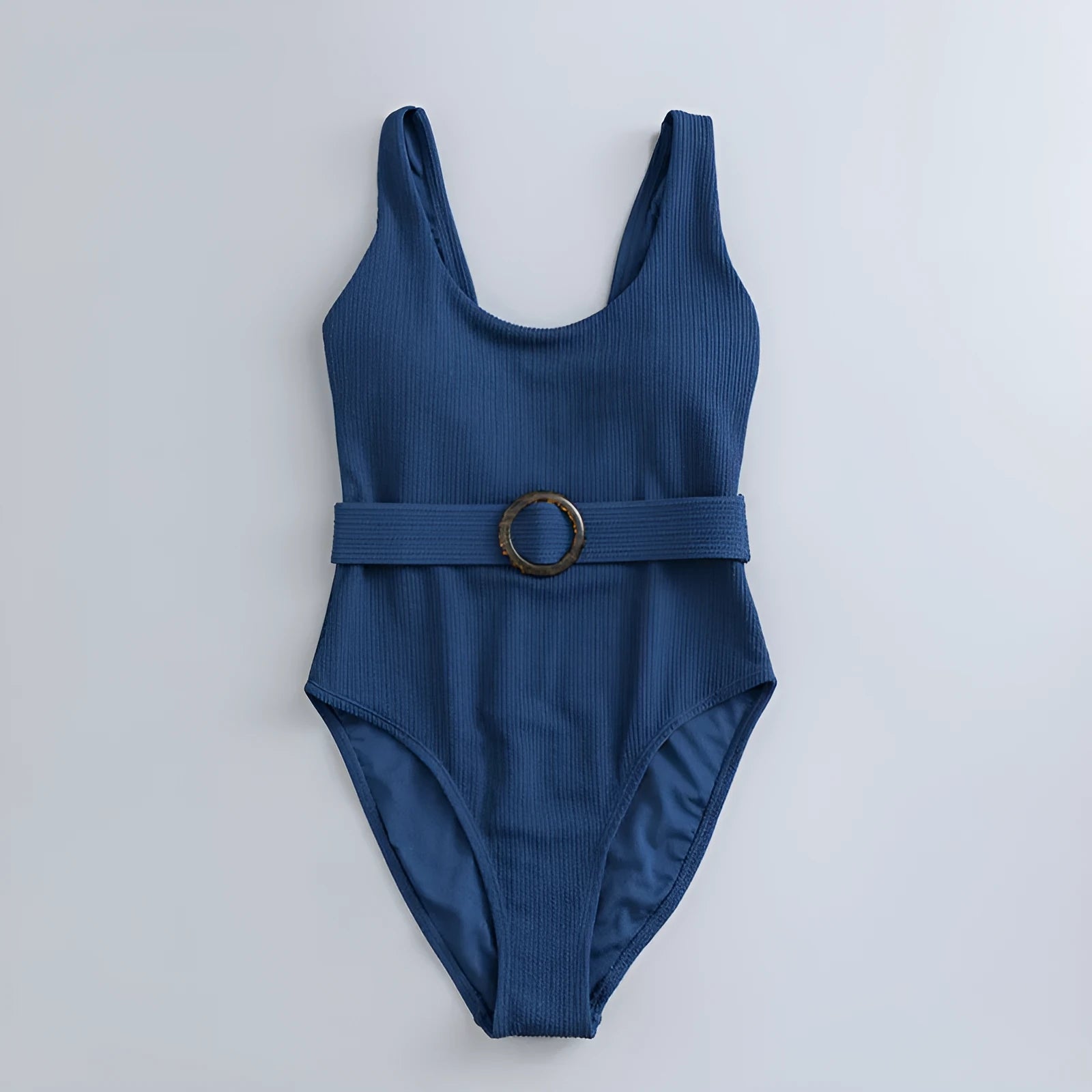 Navy blue women's one-piece triangle swimsuit with chest pads on a mannequin, showing the sleeveless slimming design.