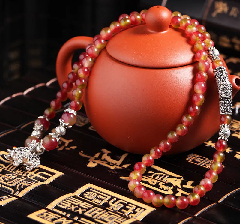 Handmade natural watermelon crystal bracelet with Chinese knotting in elephant style geometric design