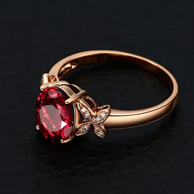 Women's rose gold plated butterfly ring with heart charm in red or blue colour options