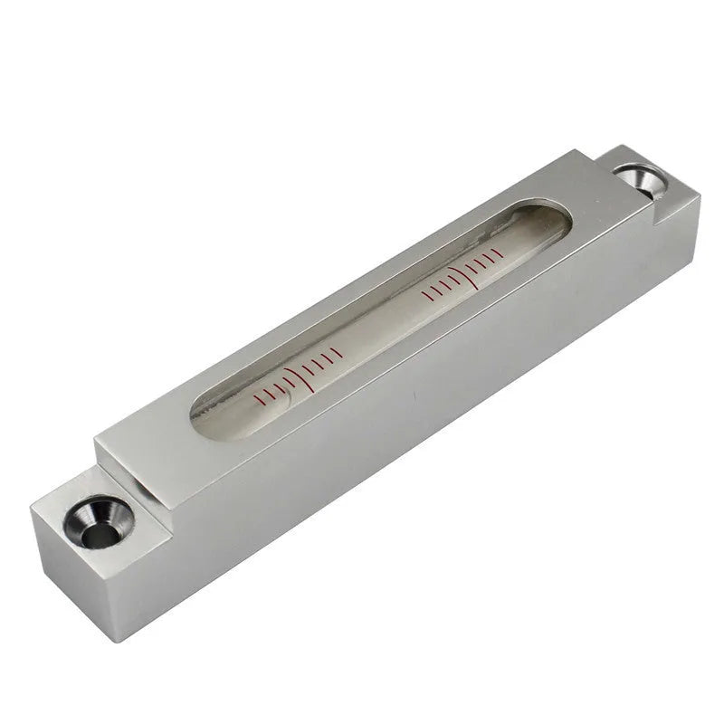Compact metal and glass spirit level for machine tool and decoration measurement.